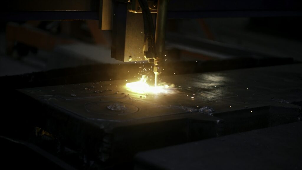 Work at the factory. Clip. Sawing of iron with special equipment using a laser.